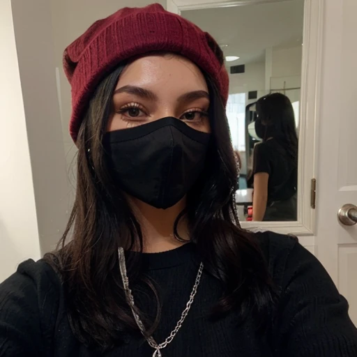 Sexy girl with long black hair taking a selfie with a black mask, a red sweater and a black cap with a black cap and silver chain