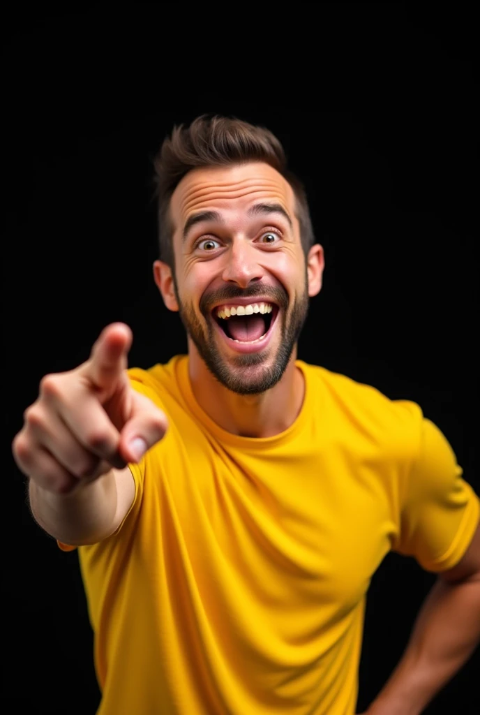 A man with a big smile on his face. He is wearing a yellow t-shirt and is pointing his finger towards his right side. The background is black.