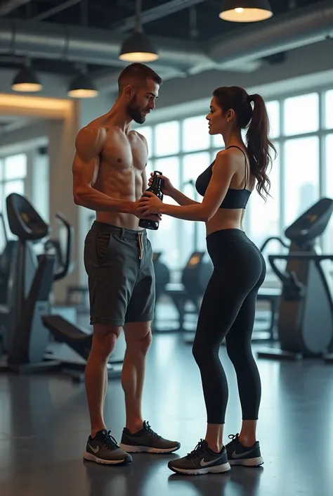 A very skinny man at a gym and shapy gym worker girl with water