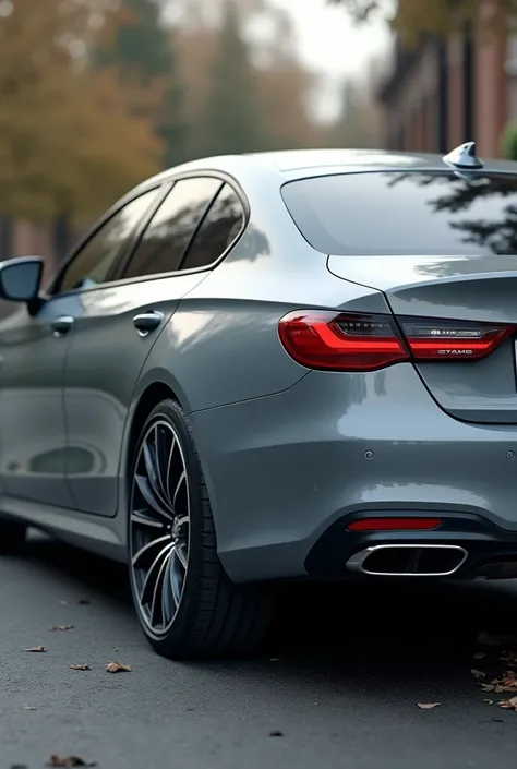 Rear photo of a gray car with a misaligned tire