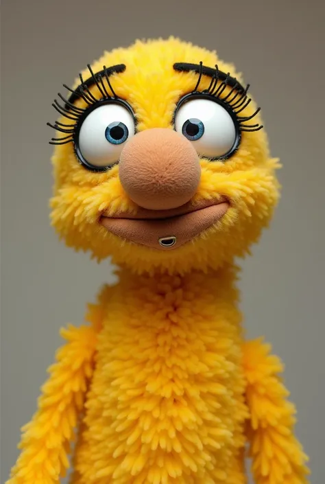 Yellow plush puppet or marionette, with big, close-set eyes; thick eyebrows together and black; a large, elongated brown nose with a nose piercing