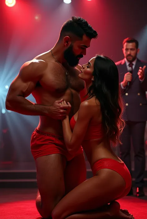 A young Puerto Rican man with a beard, hairy, strong and muscular, in red underwear, having his groin touched and smoothed by a beautiful woman in red panties crouching in front of him, in performance on a stage of a television program presented by a famou...