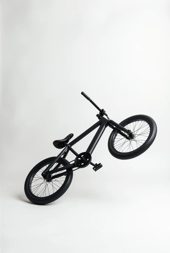 A bicycle painted matte black on its side against a white studio background 