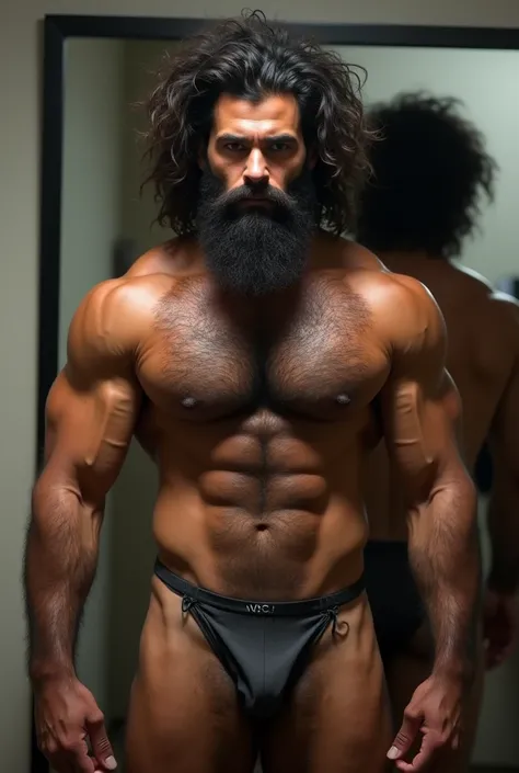 Strong, hairy, bearded, mixed race Brazilian man in front of the mirror, naked, from the belly down, thong underwear, very hairy groin, only bust showing.