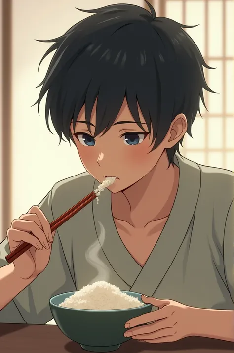 The handsome japanese boy was eating the rice 