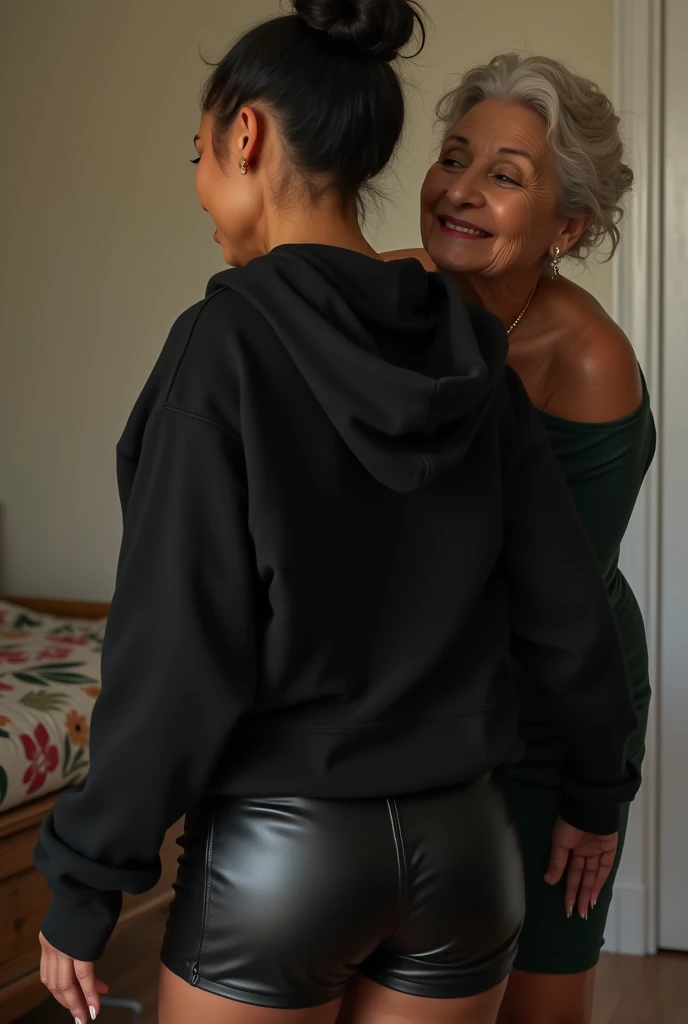 black woman hair in a bun black hoodie black leather short shorts being fucked in the ass by a old grandma in a dress