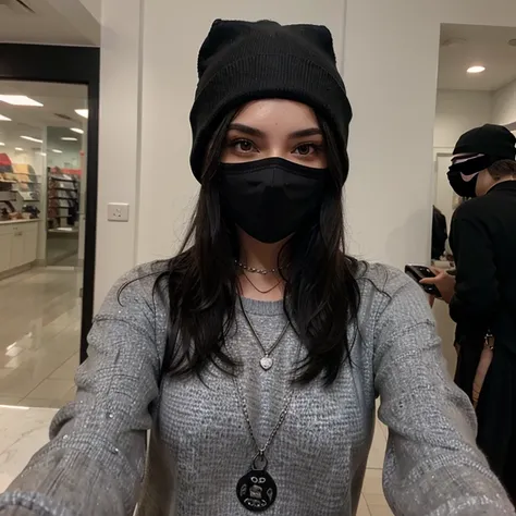 Sexy girl with long black hair taking a selfie in a black mask, a gray sweater and a black cap with a black beanie t silver chain
