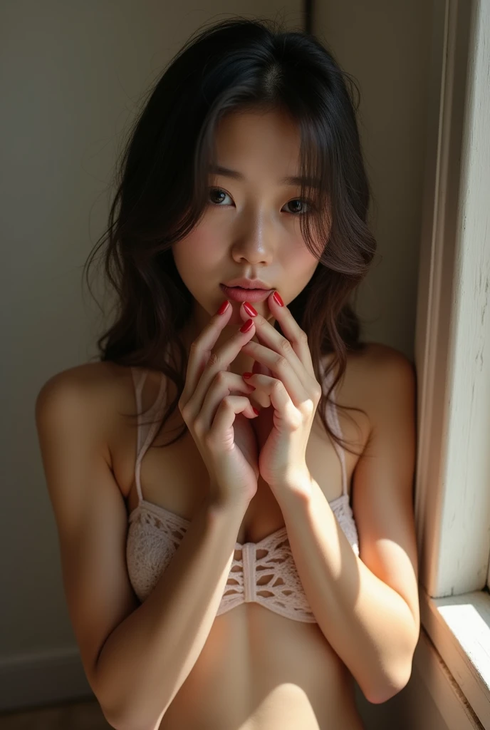 A nude Asian girl fingering