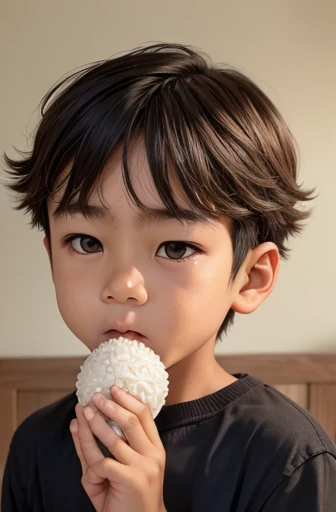 a boy holding a rice ball close to his mouth