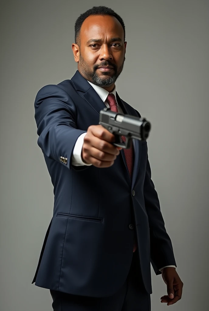 Ethiopian prime Minister Abiy Ahmed 
holding a gun 
