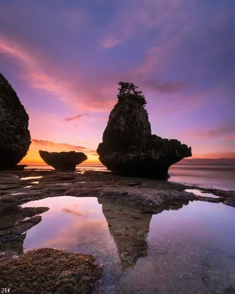 sunset reflection, rocky shorelines, tidal pool, still water, pink and purple sky, gentle waves, coastal scenery, clear skies, n...