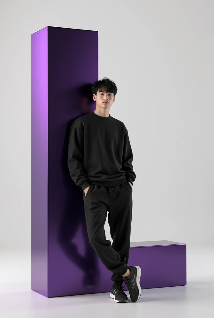 A 20 year old boy with dark hair, dressed in a casual outfit including a black sweatshirt, jogger pants, and sneakers. The person is leaning against a large purple glossy letter L, which is Black with white accents. The overall color scheme is minimalistic...