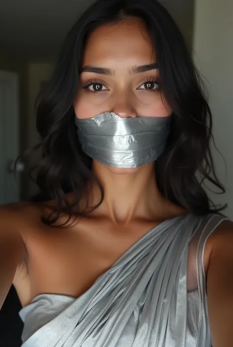 Aesthetic Indian Girl blindfolded Duct tape gagged in sexy silver shimmering prom saree Taking selfie gagged