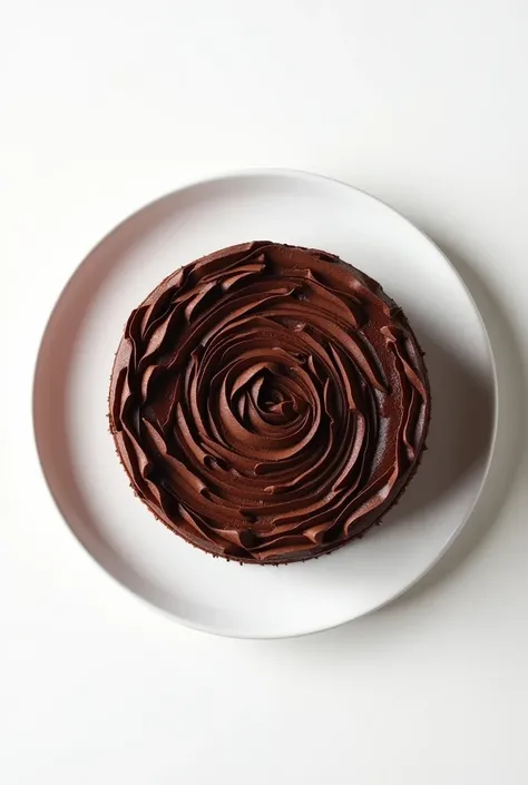 make me a photo of chocolate flossroll cake on a white plate, shot from the top