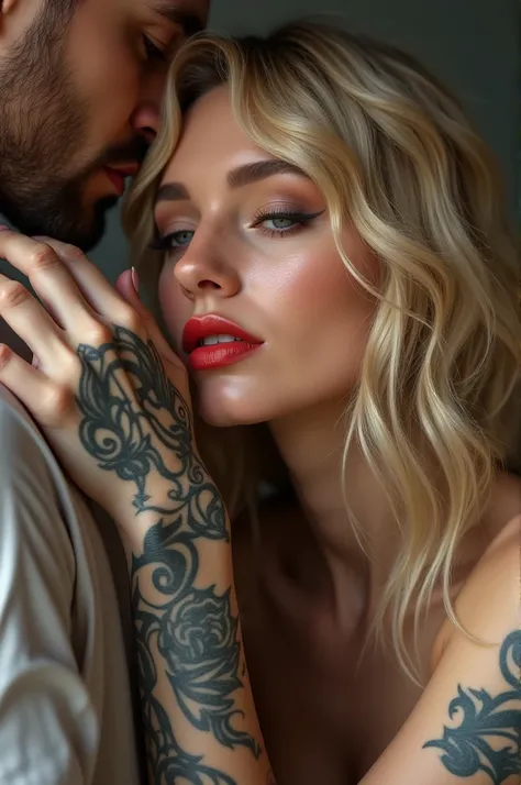 Beautiful blonde woman with wavy hair, the tattooed man&#39;s big hand caressing her red lips