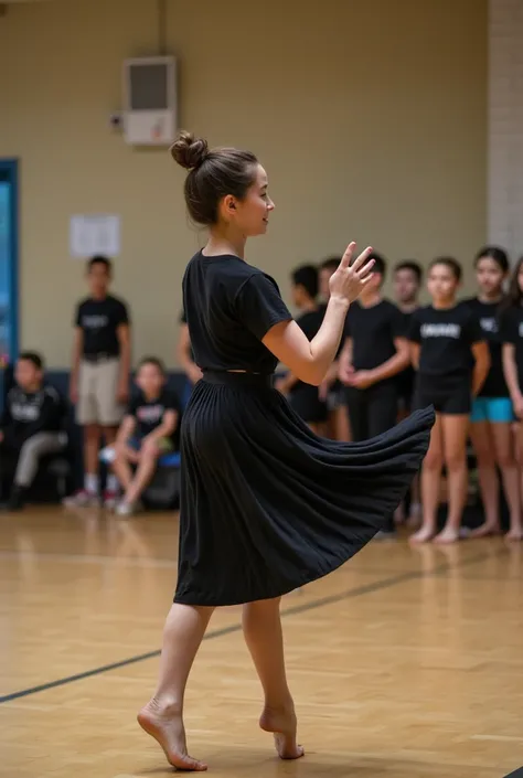 A professional dance teacher who is teaching dance to the whole school at one time 