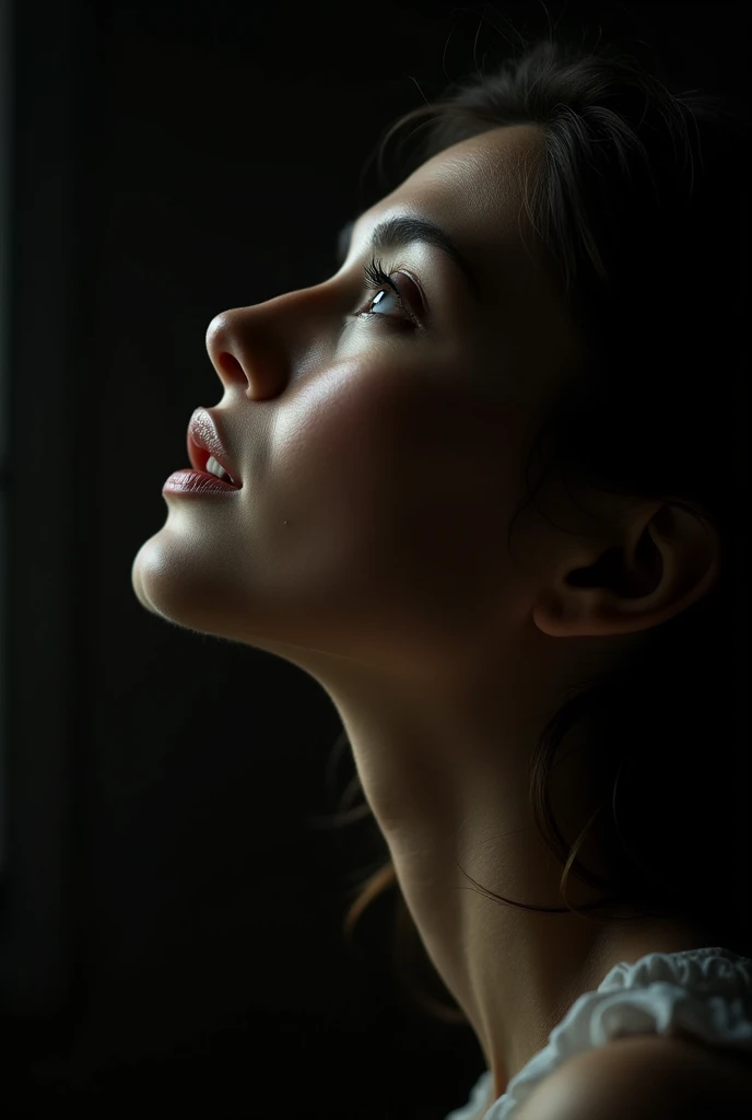 woman looking up side profile three quarter of the face showing with lighting coming from upward 