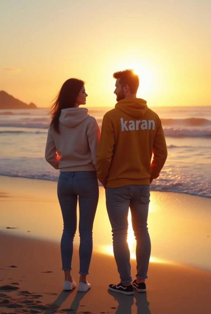 - There are two people in the image, a man and a woman.
- They are standing on a beach.
- The sun is shining behind them.
- They are both wearing hooded sweatshirts.
- One of the sweatshirts has the name "Karan" written on the back.
- The couple appears to...