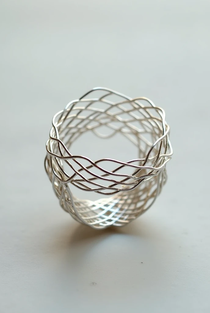 the ring, thin intertwined silver threads that form the ring, without stone.