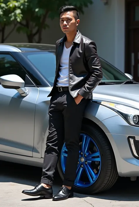 Handsome indonesian man, crew cut hair, wearing fancy oufit, with black leather shoes standing next to silver Suzuki Aerio with blue casting wheels