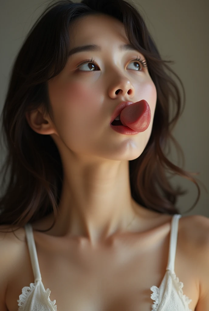 Naked young Korean woman with extra large nipples sticking out her tongue and looking up while sucking a penis
