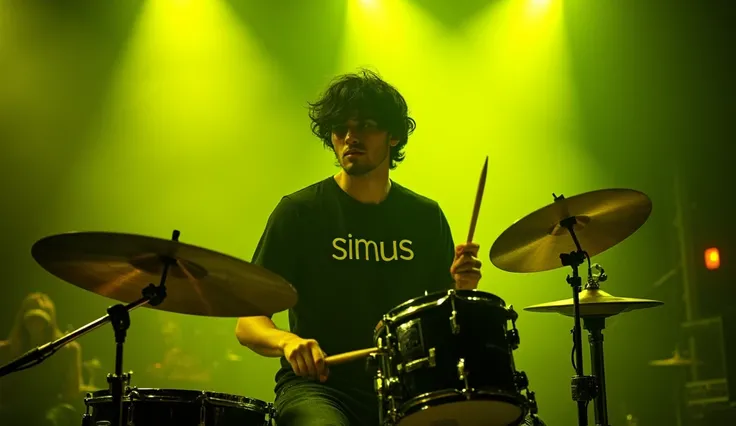 a young male musician who performed on stage with great energy. He wore a black T-shirt that read "SiMus", which gave the impression of a unique and bold style. His hair is black in colour. He seems to be playing the drums in a professional style with grea...