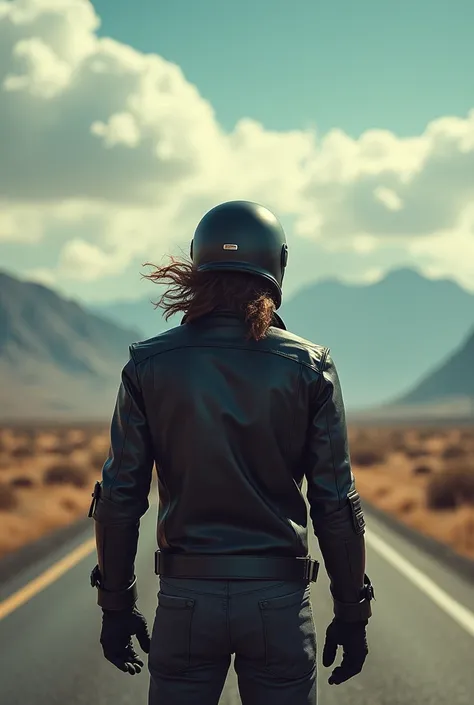 An epic photo of a biker standing with his back turned and wearing a helmet 