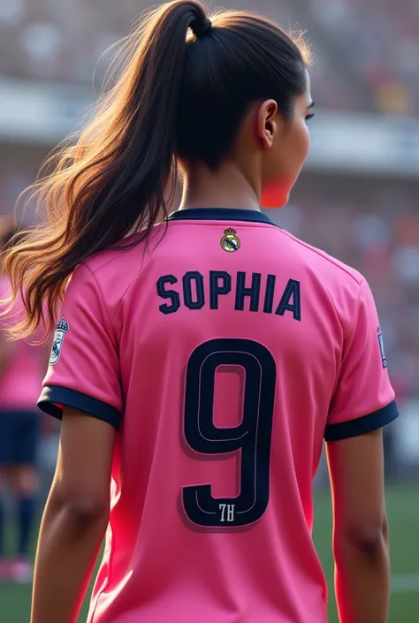 Girl from behind wearing the pink shirt of the Real Madrid soccer team with the name Sophia
