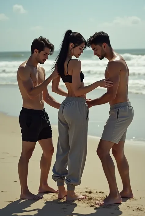 Black hair tied back on the beach, grey baggy sweatpants, barefoot, sexy and skinny woman. 2 men touching a woman. 