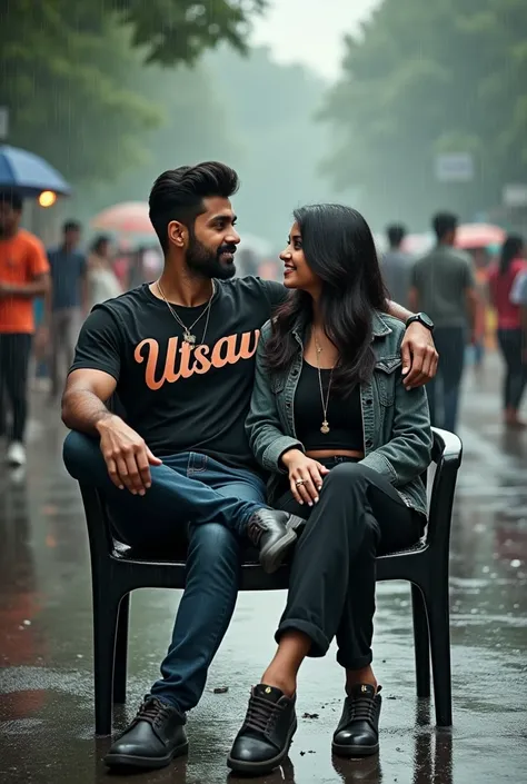 a real 1 Indian couple is sitting comfortable on casually black chair in a beautiful city road. He is stylish with gun  is  boy wearing black t-shirt with jacket and shoes “utsav ”written on it bold latters in t-shirt and his both sides of road group of pe...