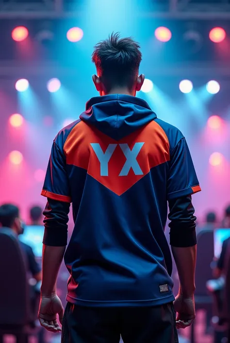 A esports player standing in frotn side.hi is wearing a esports jersey and behind his jersey name is YX