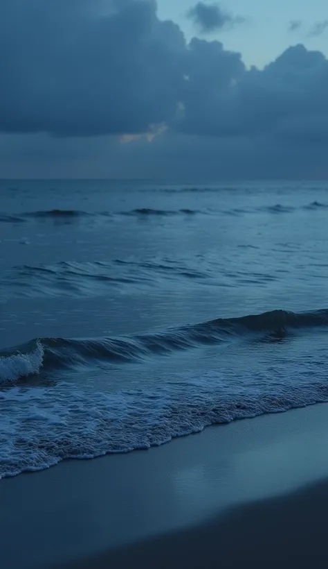 Calm Ocean Waves: A serene view of gentle ocean waves lapping against the shore under a dark blue sky 