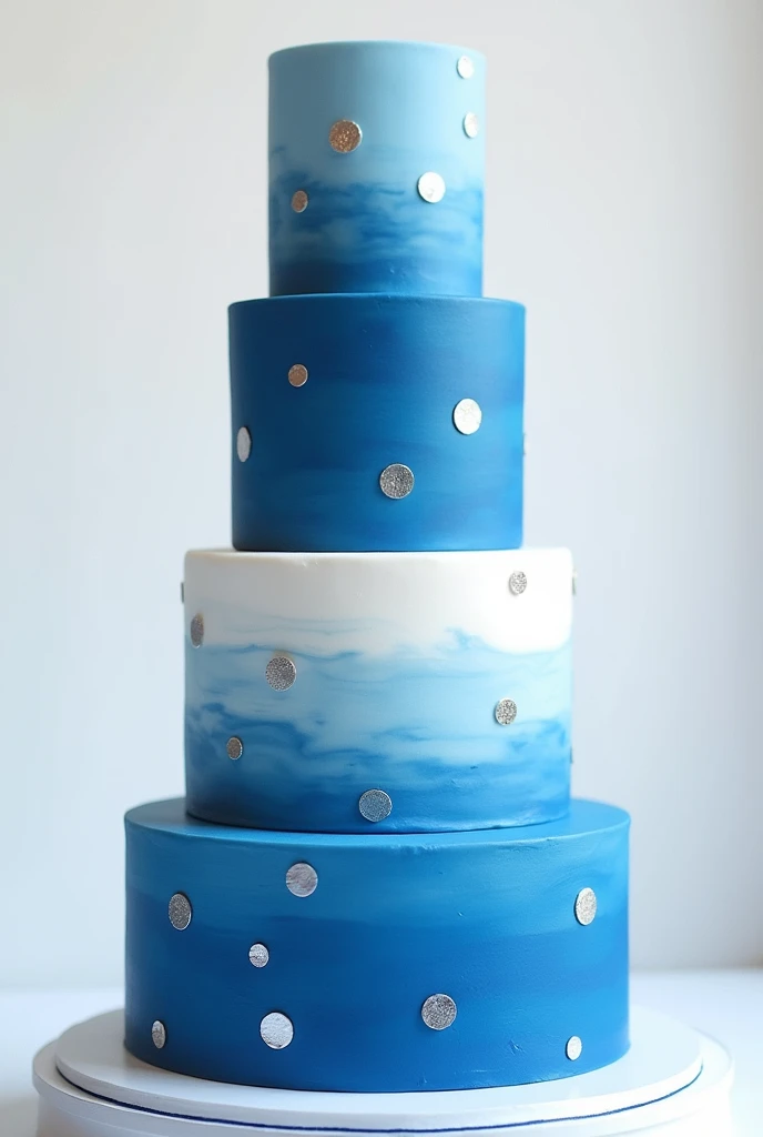 4 tier blue and white cake with silver dots