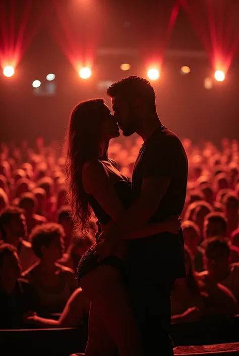 A man and a hot woman having sex on a theater stage with hundreds of people watching.