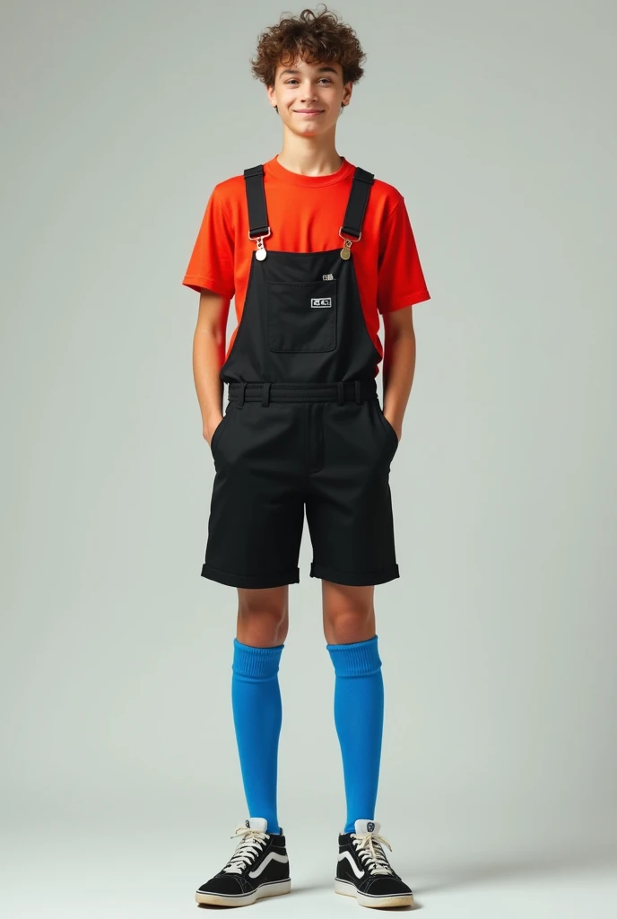 Young man wearing extra long blue over the knee football socks , black short overalls and red shirt under the overalls, full body standing 