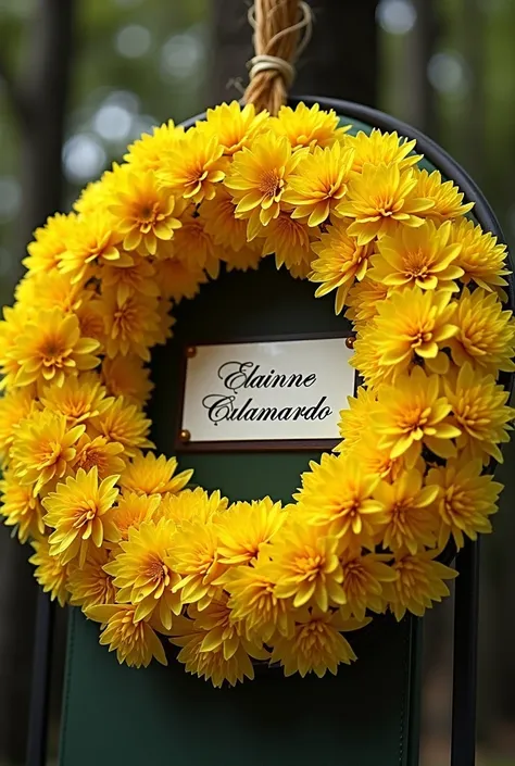 A floral arrangement called a wreath with yellow flowers for a person who died that in the center says the name Elainne Calamardo 