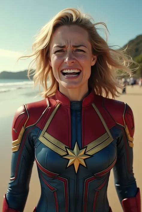 Captain Marvel mad and crying on the side of beach