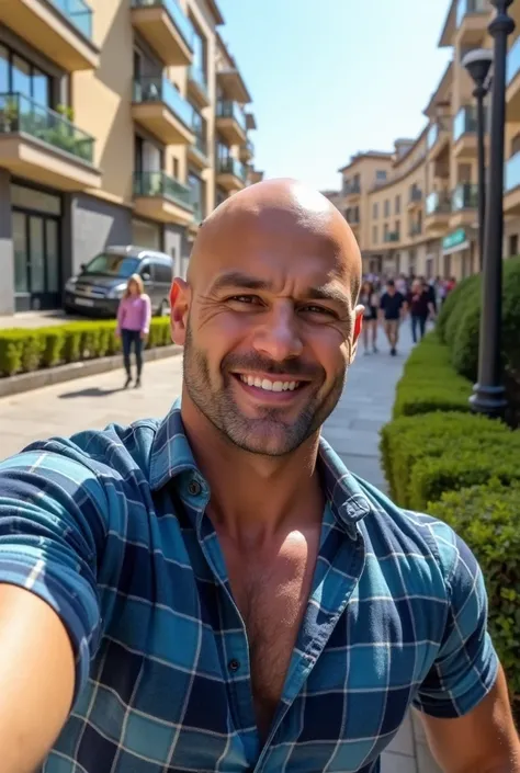 A strikingly attractive and muscular 4 bald man with a neatly groomed two-day stubble is taking a selfie on a bright, sunny day in the bustling streets of Vigo. His confident smile and chiseled jawline exude charm, while his fitted blue plaid shirt highlig...