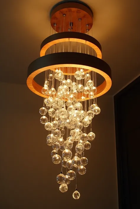 Luster, three wooden circles and crystal balls creating a cascade effect, assemble a living room chandelier with this information.  A larger circle, a medium circle and a smaller circle and a crystal waterfall at the end.