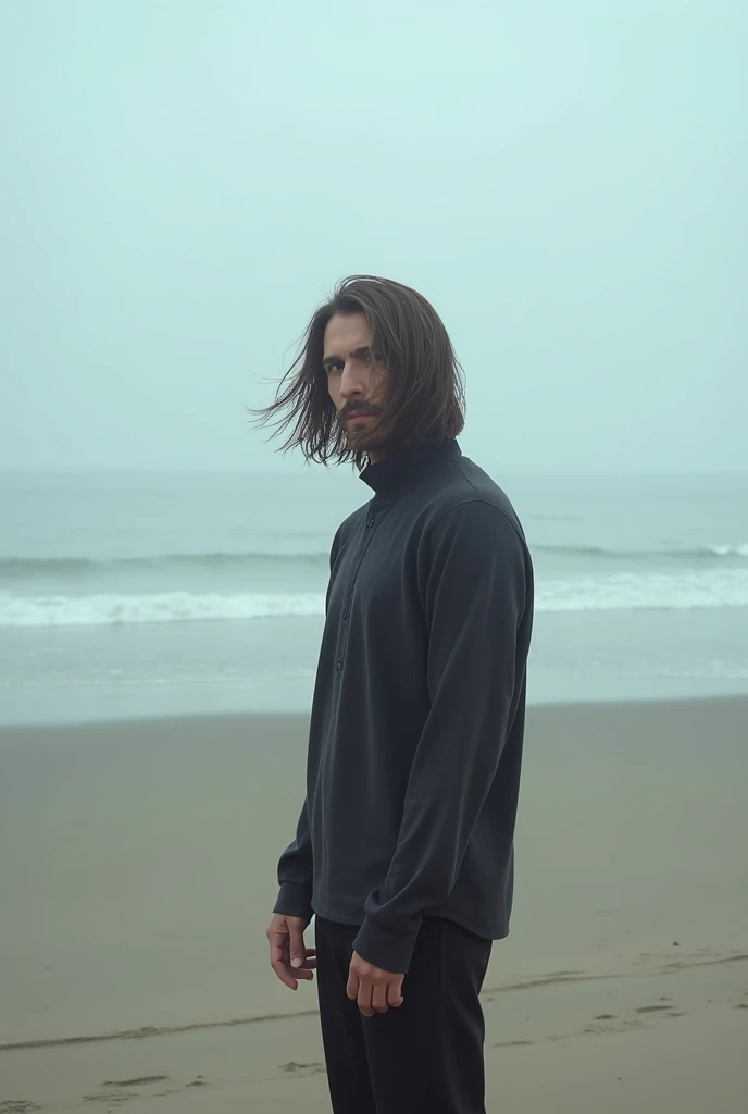 Create a photo of a man with long hair from behind on a beach