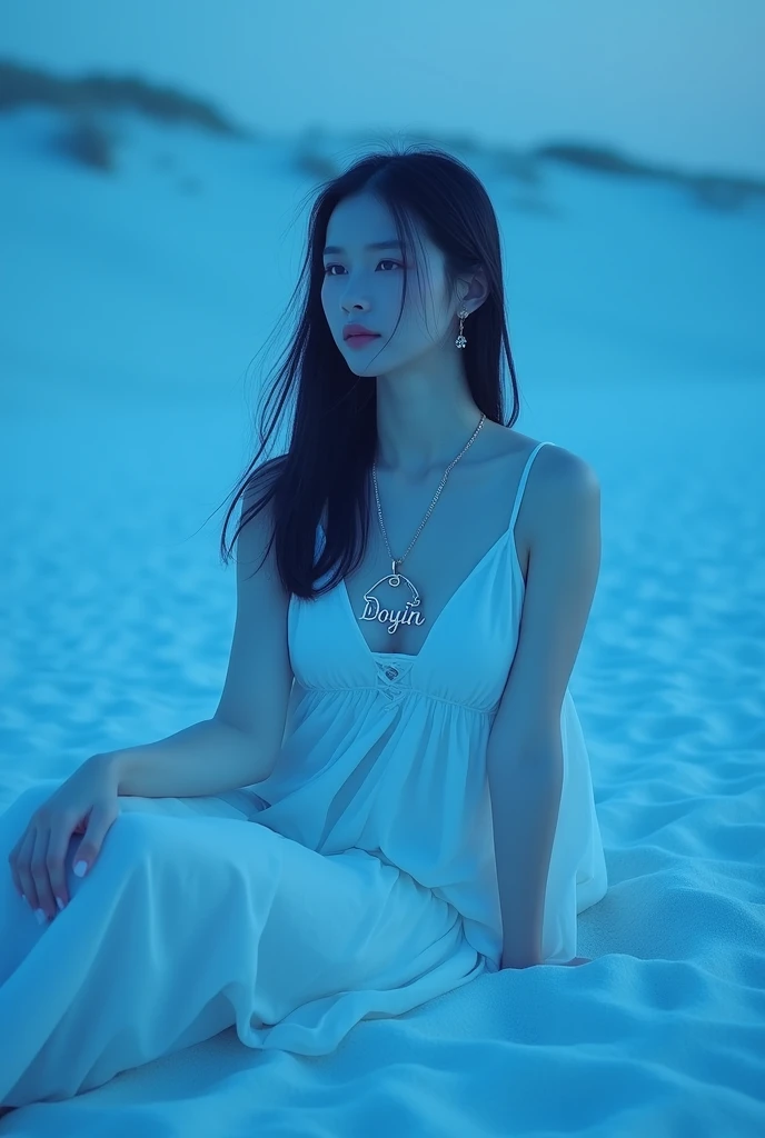 She is there in the sand seating in the sand with a blue lights and have a big name in the necklace DOUYIN with a  sample white dress