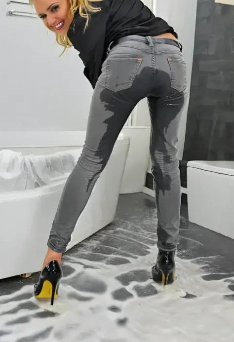 (((rear view))), 80s setting, attractive blonde woman wearing black satin blouse, gray skinny jeans, wavy hair, high heel pumps, sitting in bed,  wetting, big smile, ((pee stains are gleaming wet)), ((lower legs are soaking wet)) , shoes are flooded with p...