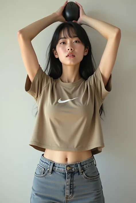 A Japanese woman wearing a khaki Nike t-shirt and raising her arms to show her armpits, wearing a mouse opener