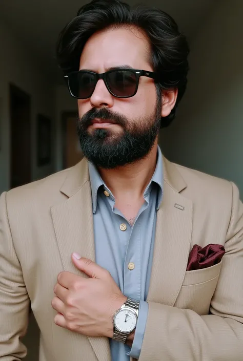 A man with a well-groomed beard and stylish sunglasses.. He is dressed in an elegant, tailor-made suit made to measure, with a smart blazer and a crisp dress shirt. The blazer is a deep beige with subtle stripes..., And the shirt is the color that best mat...