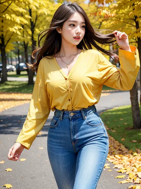 Autumn leaves dancing in the wind。Yellow leaves dancing in the wind 。 beautiful woman in a shirt and blue denim。 walking with hair fluttering in the wind 。