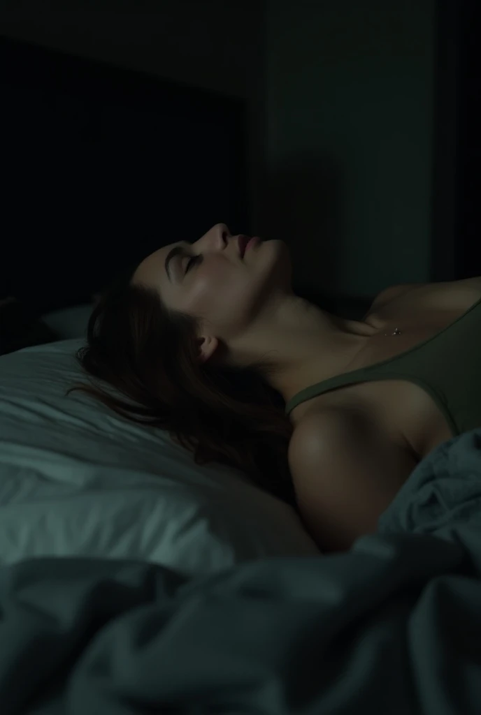 Woman lies back on the bed, staring at the ceiling. As the lyrics continue, she closes her eyes, a tear escaping.a dimly lit bedroom. The camera pans over a bed with rumpled sheets and scattered clothes. Soft piano music begins to play, setting a melanchol...