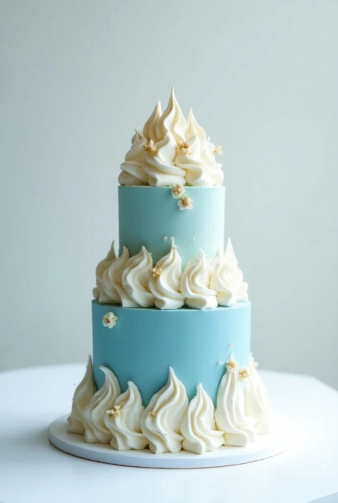 A SIMPLE TWO-STORY CAKE OF BLUE, WHITE AND GOLD WHIPPED CREAM ON TOP.