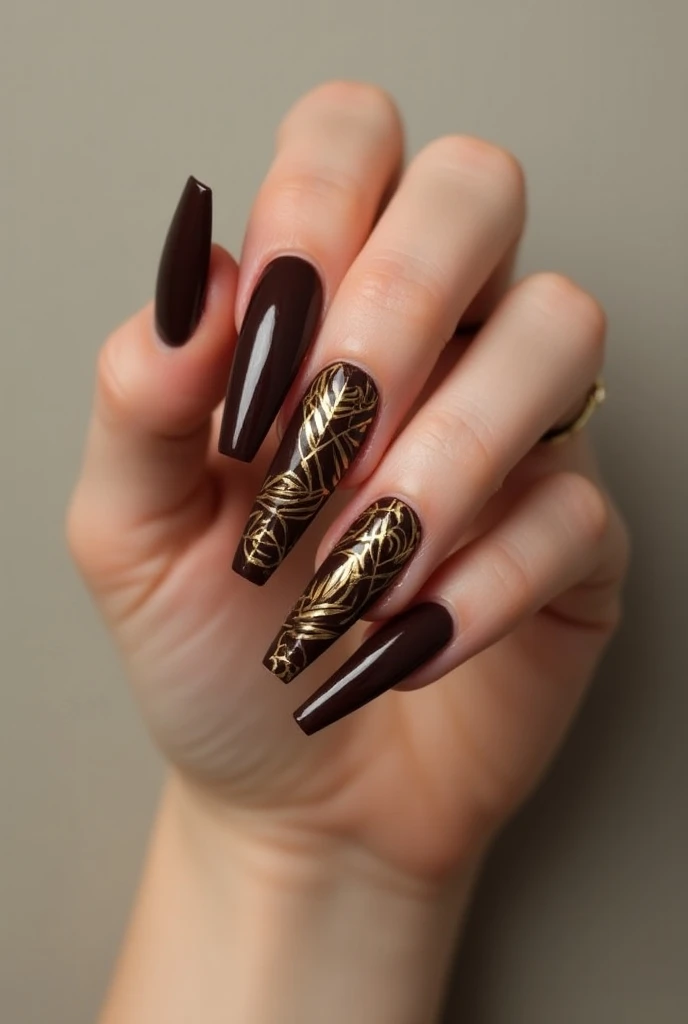 Long coffin style shiny chocolate brown nails with choreated style design in gold color 