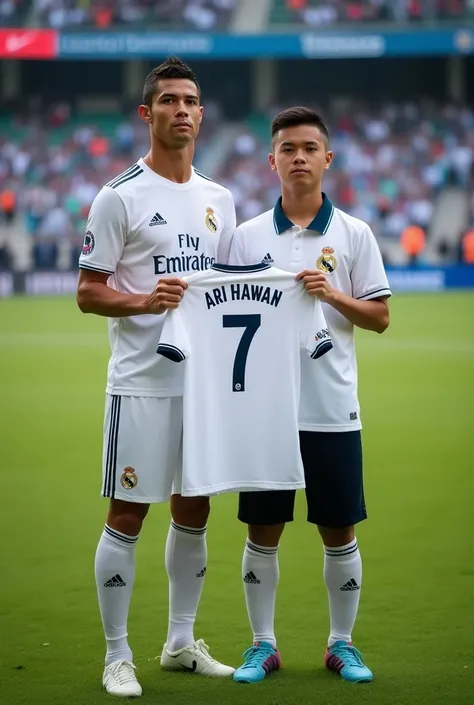 Photo Cristiano ronaldo ,real Madrid soccer  jersey, next to an indonesia man 23 years with neat skin wearing a real madrid polo shirt, they are holding a real nadrid soccer shirt that says "ARI IRAWAN". number "7". He was standing on the grass field. The ...