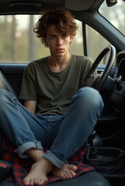 Barefoot teen boy in car